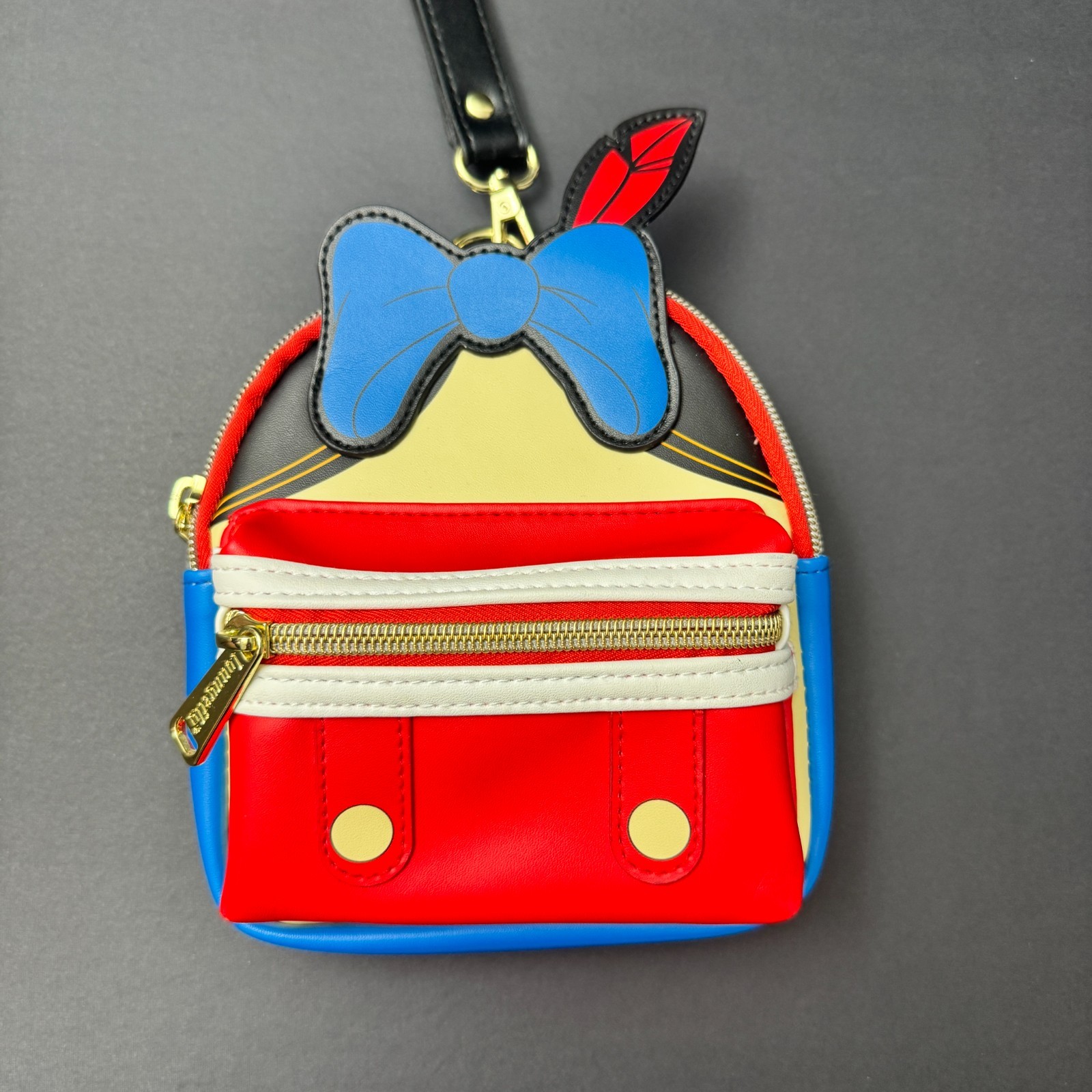 Loungefly Disney Pinocchio Figural Wristlet Exclusive Red Blue Bow — photo 1